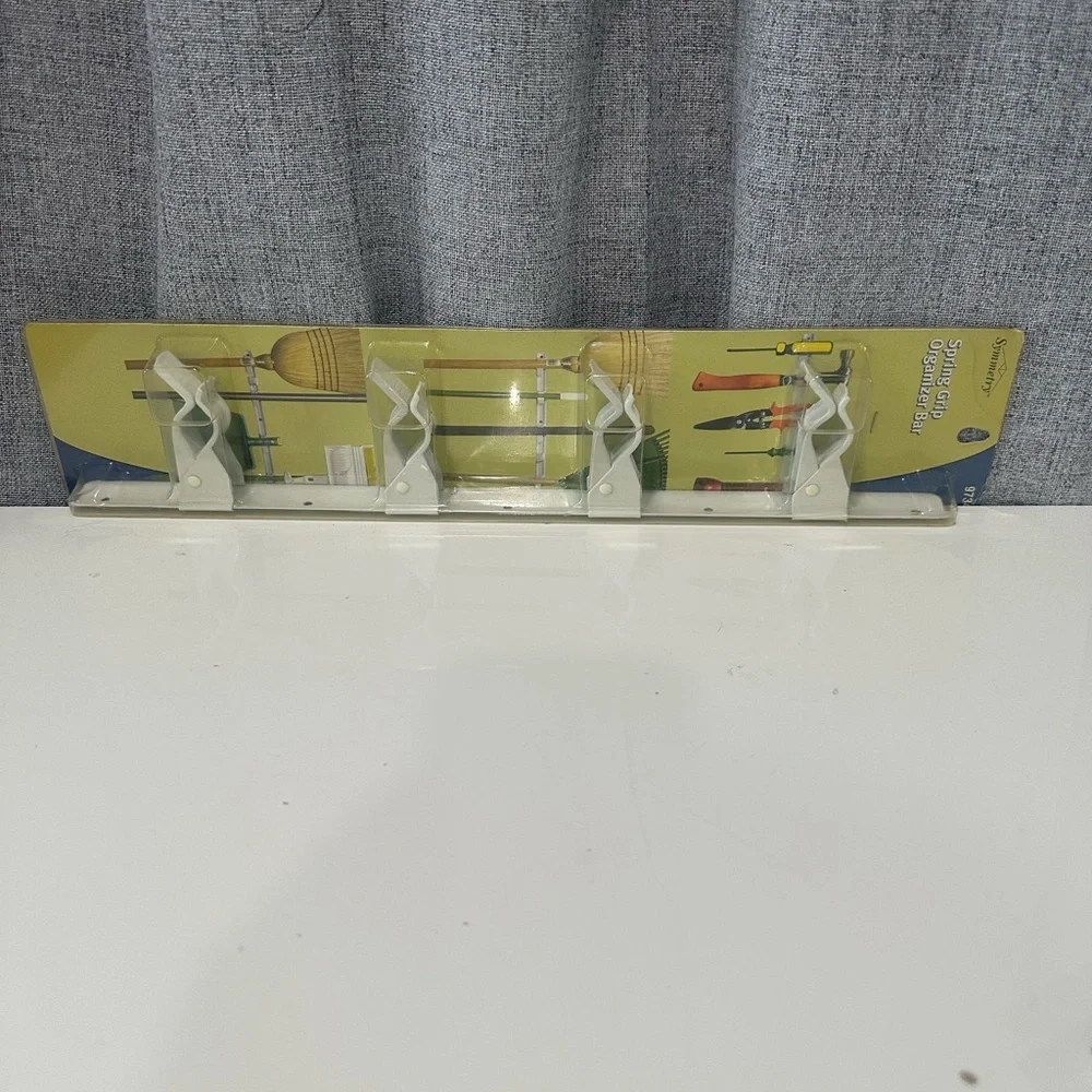 Symmetry spring grip Wall Organizer with White Holders. NWT.